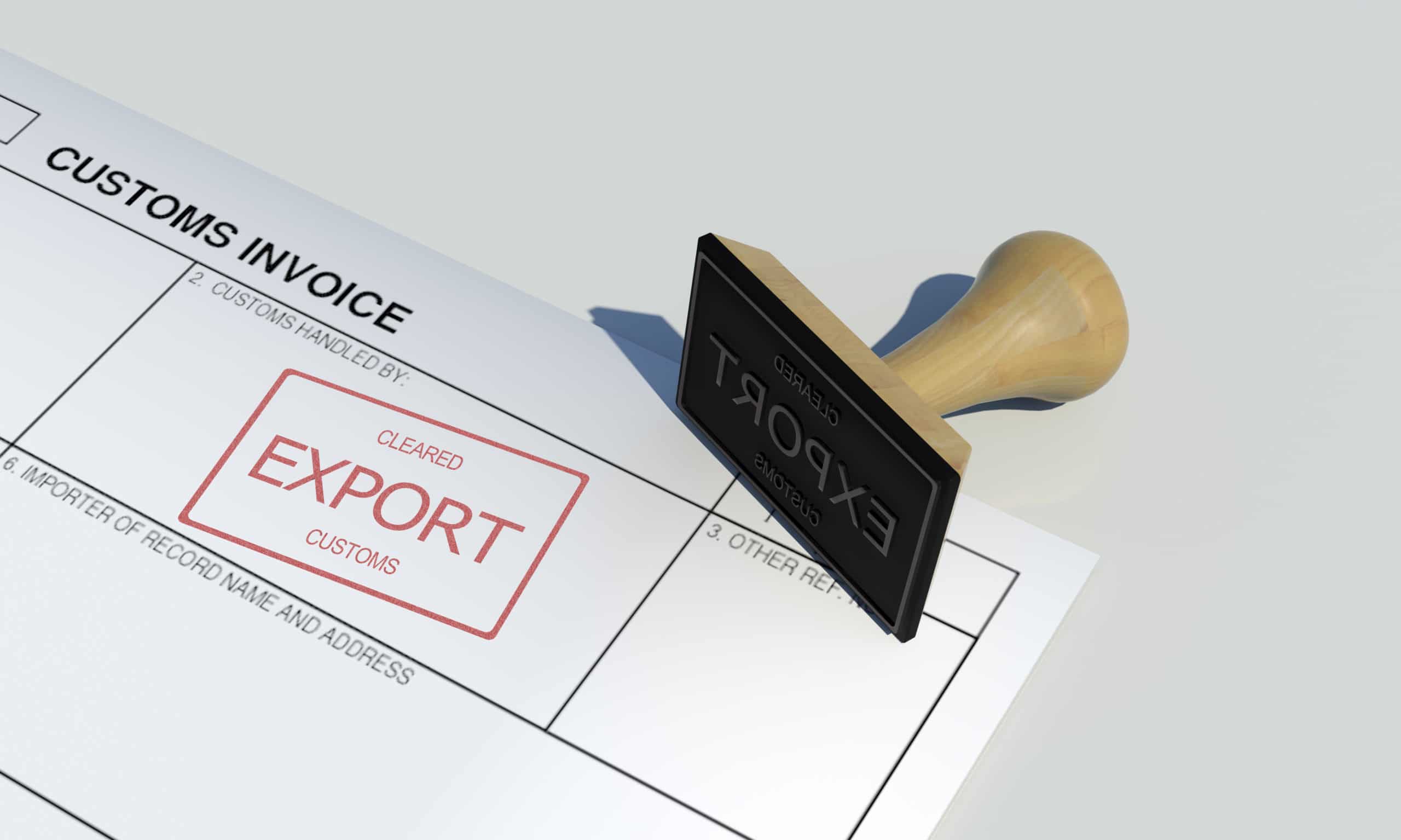 Export cleared approval stamp of customs clearance border control service on customs invoice paper with wooden stamper isolated on table surface government border protection wide scene background